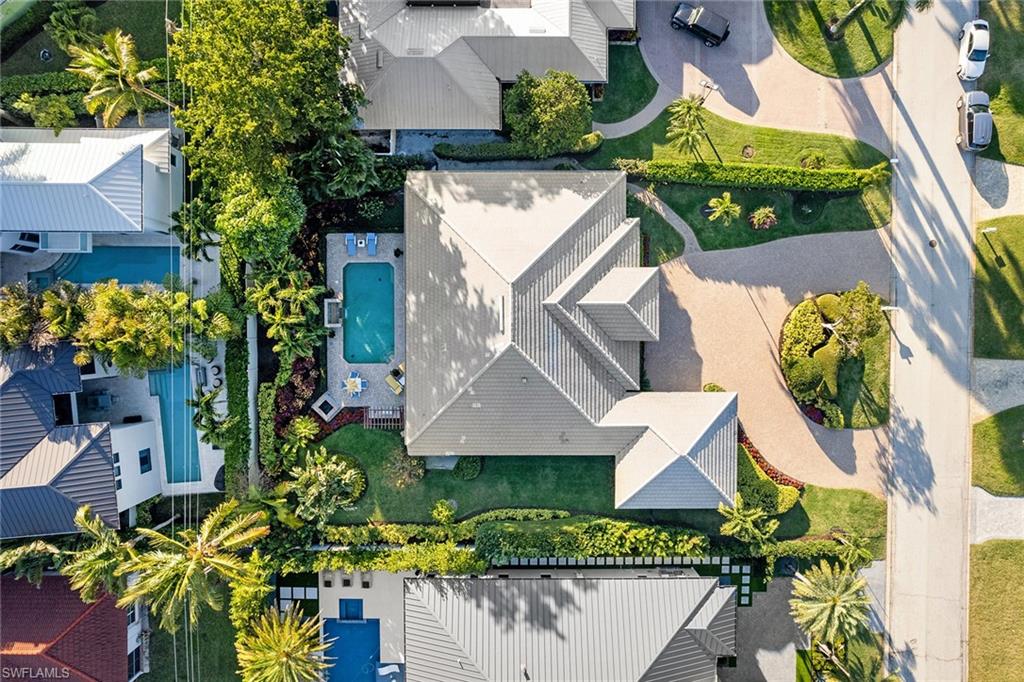 540 Ketch Drive Naples, FL 34103 - Photo 30 of 32 an aerial view of a house with a yard and garden