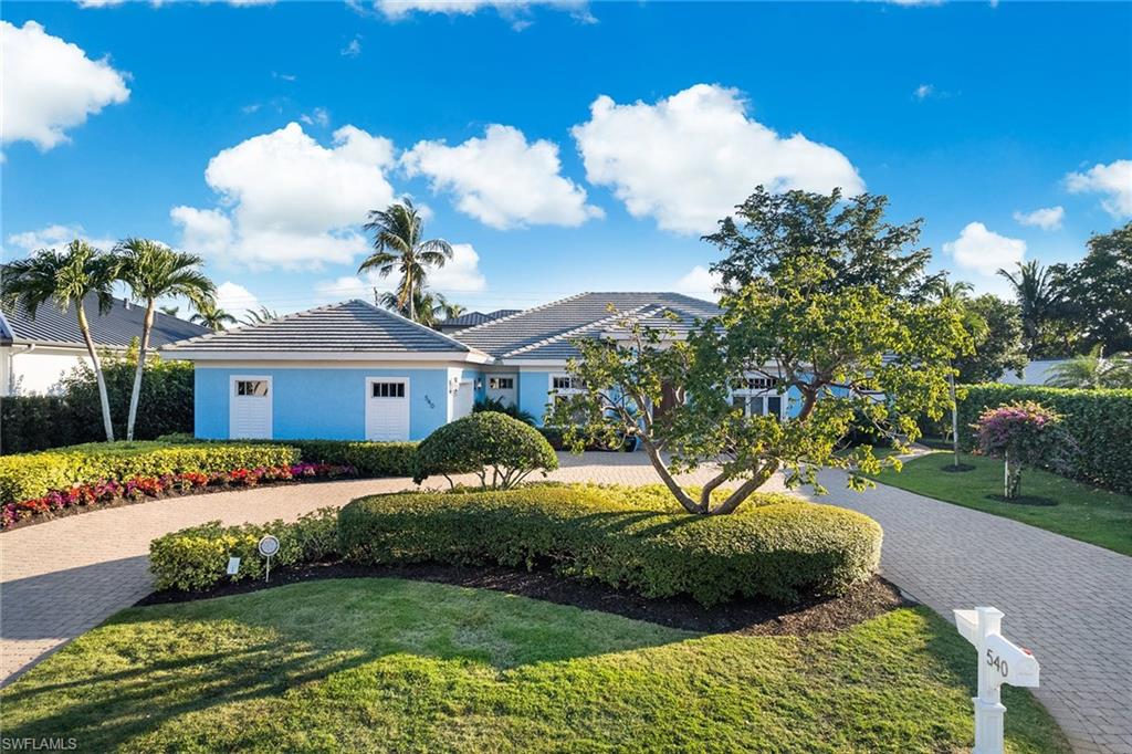 540 Ketch Drive Naples, FL 34103 - Photo 3 of 32 a view of a house with a yard