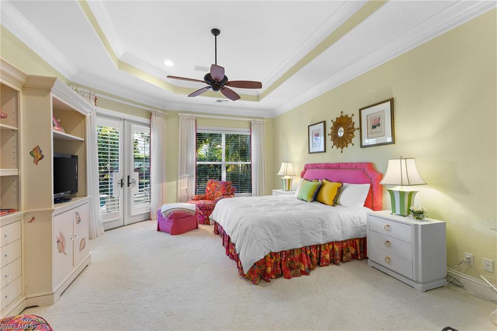 540 Ketch Drive Naples, FL 34103 - Photo 4 of 32 a bedroom with a bed and a flat screen tv