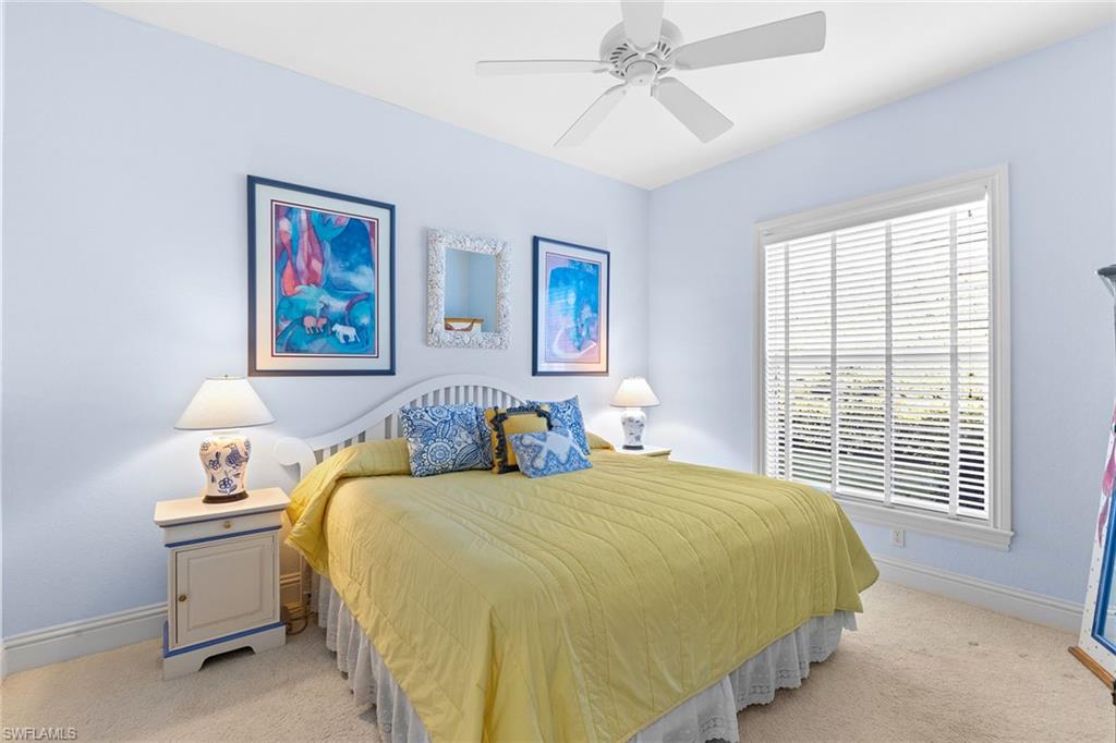 540 Ketch Drive Naples, FL 34103 - Photo 8 of 32 a bedroom with a bed and a window