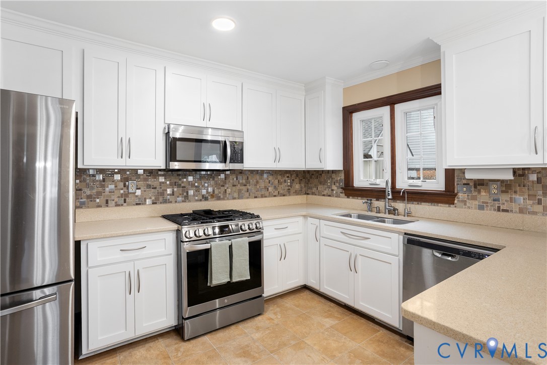 3613 Stoney Ridge Road Midlothian, VA 23112 - Photo 13 of 50 a kitchen with a stove top oven sink and refrigerator