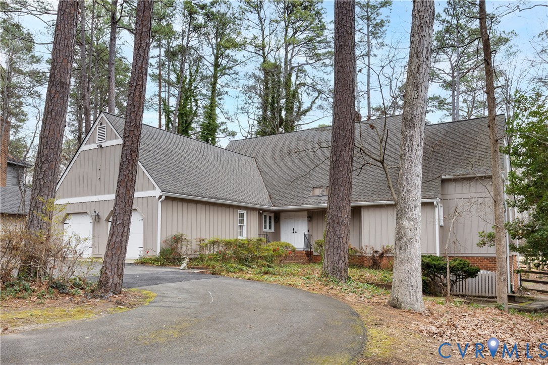 3613 Stoney Ridge Road Midlothian, VA 23112 - Photo 2 of 50 a view of a house with large windows and a tree