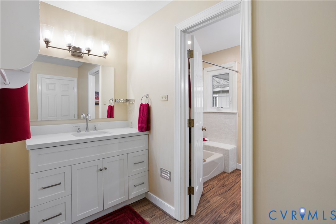 3613 Stoney Ridge Road Midlothian, VA 23112 - Photo 25 of 50 a bathroom with a granite countertop sink and a mirror