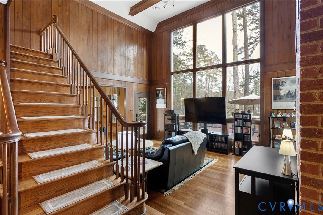 3613 Stoney Ridge Road Midlothian, VA 23112 - Photo 29 of 50 a living room with wooden floor furniture and a flat screen tv
