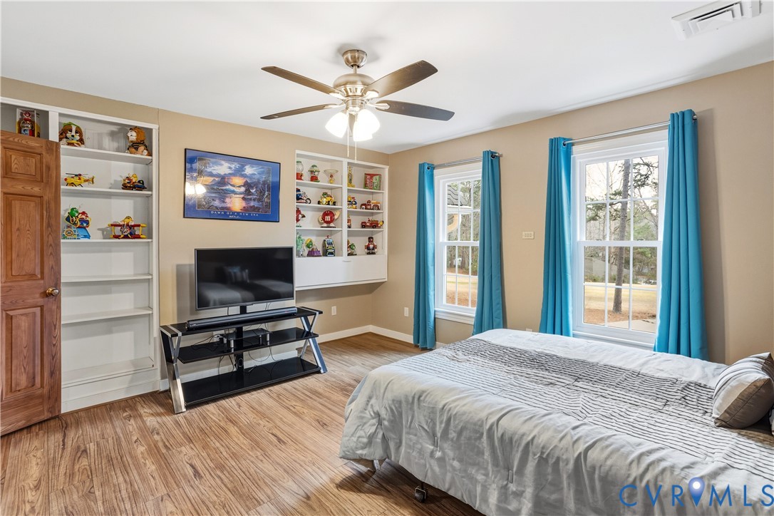 3613 Stoney Ridge Road Midlothian, VA 23112 - Photo 36 of 50 a bedroom with a bed and a flat screen tv