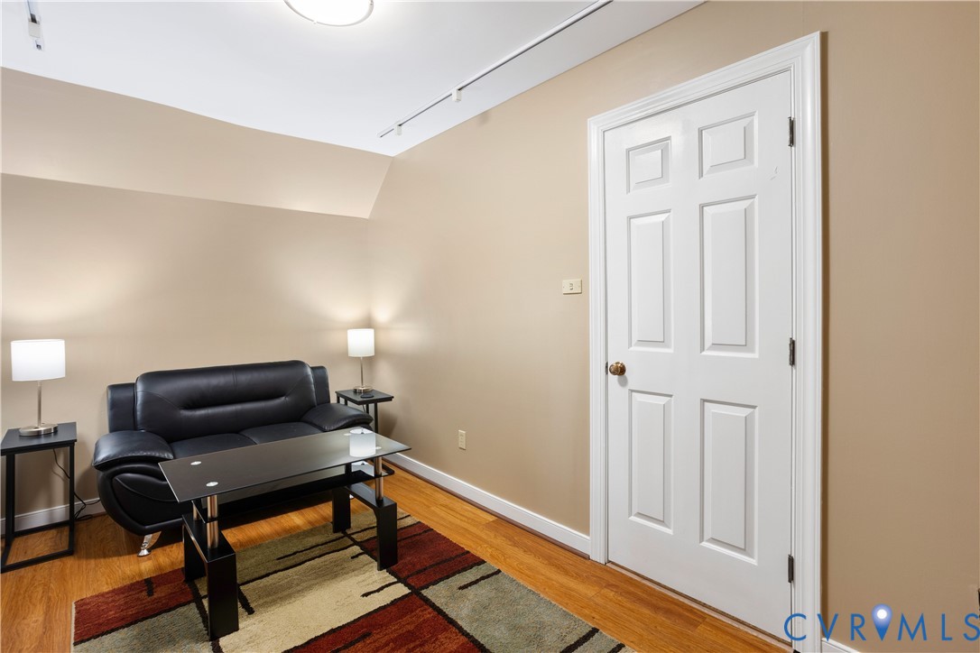 3613 Stoney Ridge Road Midlothian, VA 23112 - Photo 39 of 50 a living room with furniture and a wooden floor