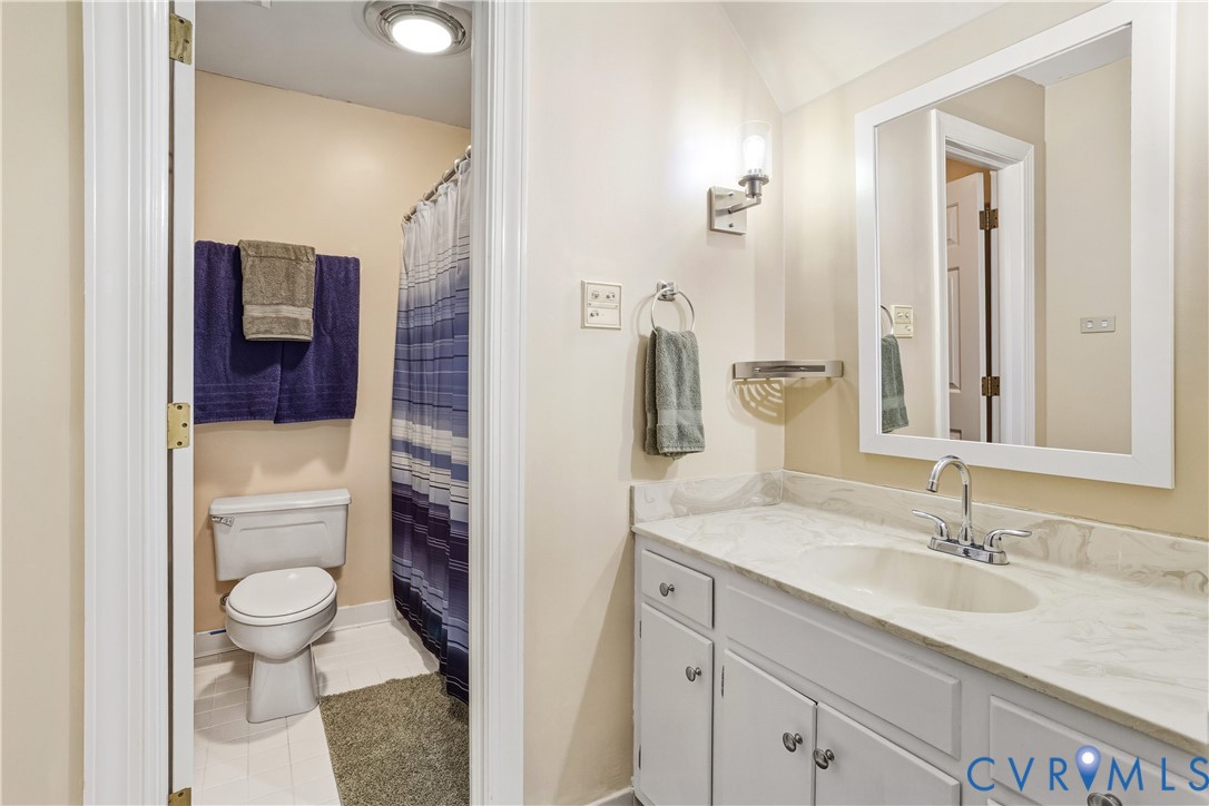 3613 Stoney Ridge Road Midlothian, VA 23112 - Photo 40 of 50 a bathroom with a granite countertop sink toilet and shower