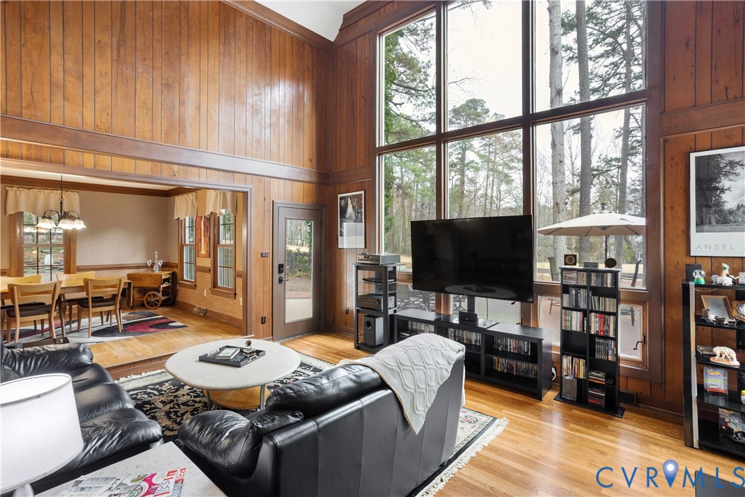 3613 Stoney Ridge Road Midlothian, VA 23112 - Photo 6 of 50 a living room with furniture a flat screen tv and a floor to ceiling window