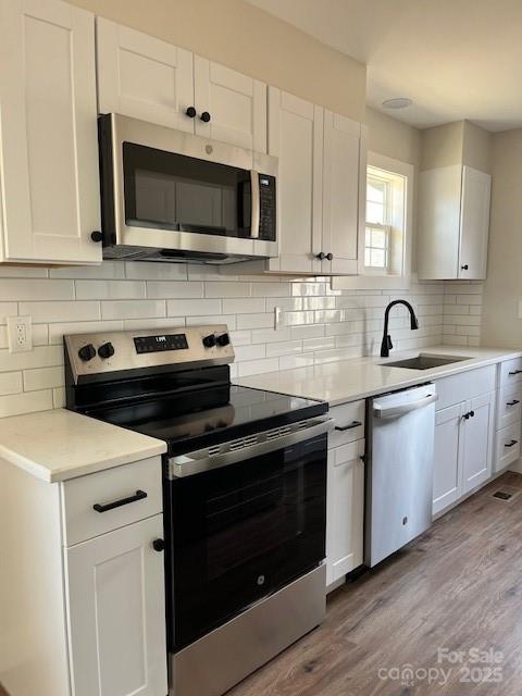 2538 Gemena Road Chapel Hill, NC 27516 - Photo 2 of 21 a kitchen with stainless steel appliances granite countertop a sink stove and microwave