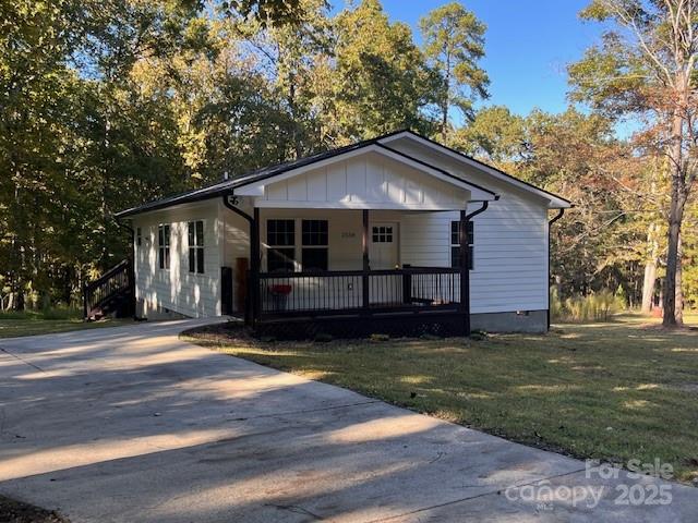 2538 Gemena Road Chapel Hill, NC 27516 - Photo 21 of 21 a front view of a house with a garden and yard