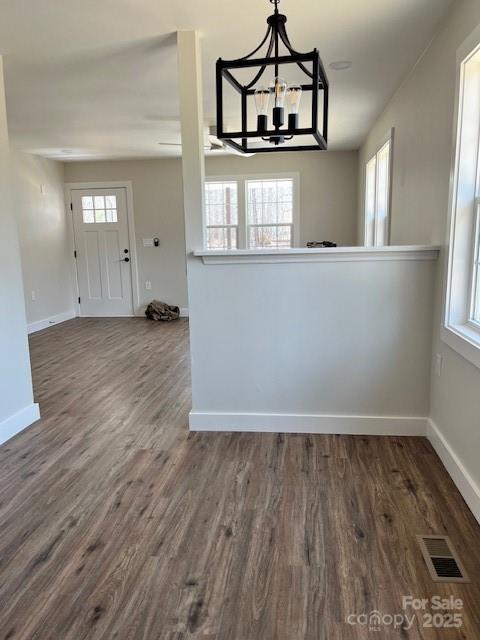 2538 Gemena Road Chapel Hill, NC 27516 - Photo 5 of 21 an empty room with wooden floor and window