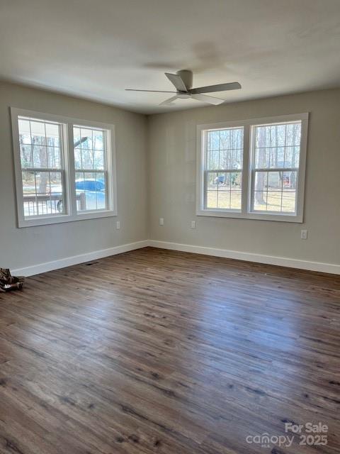2538 Gemena Road Chapel Hill, NC 27516 - Photo 7 of 21 an empty room with wooden floor and windows