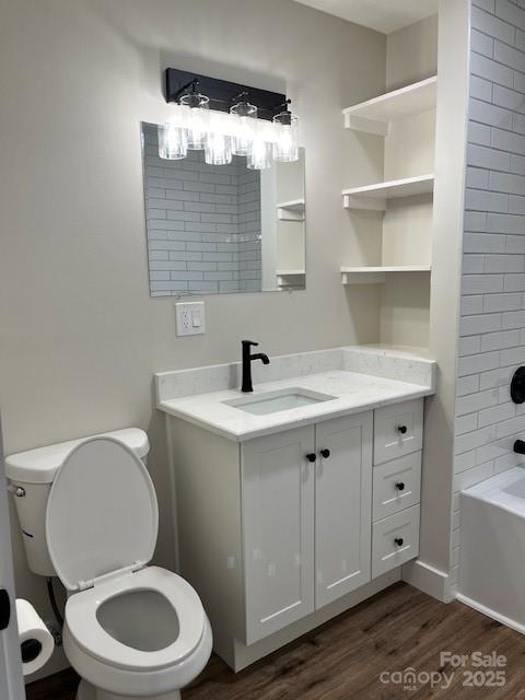 2538 Gemena Road Chapel Hill, NC 27516 - Photo 9 of 21 a bathroom with a toilet a sink a mirror and vanity