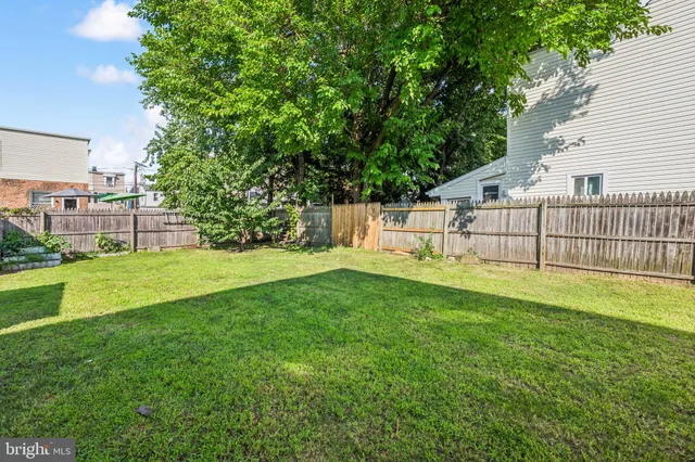 a view of a backyard with sitting area