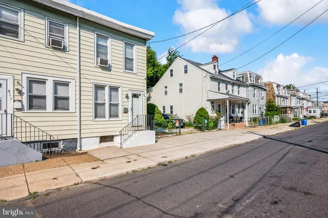 a view of a house with a street