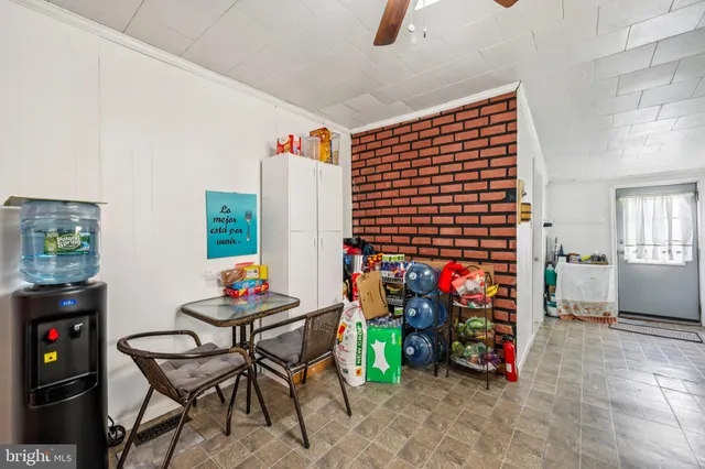 a view of a livingroom with furniture and white walls