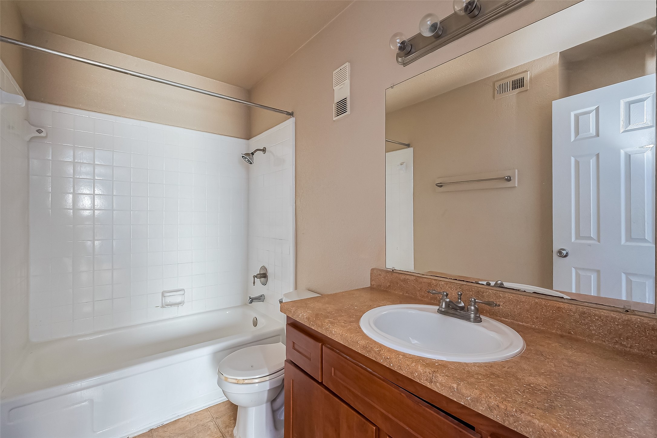 8100 Creekbend Drive, Unit 146 Houston, TX 77071 - Photo 14 of 17 a bathroom with a granite countertop sink toilet and shower