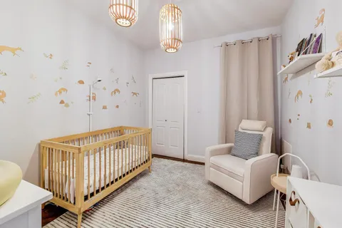 a bedroom with furniture and a window