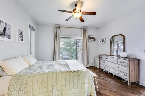 a bedroom that has a bed and a chandelier