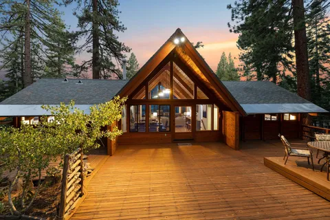 a view of house with yard and entertaining space