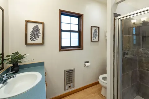 a bathroom with a tub sink and mirror
