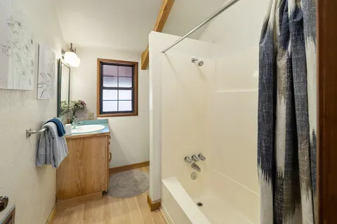 a bedroom with bed and window