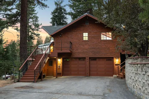 a front view of a house with stairs
