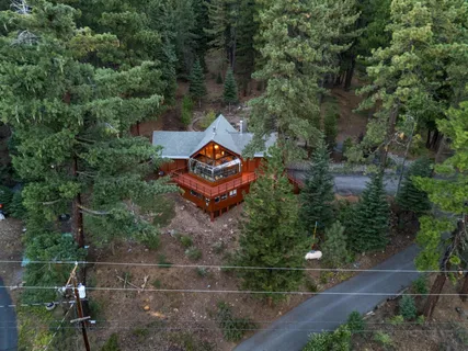 a view of a chairs and table in the balcony