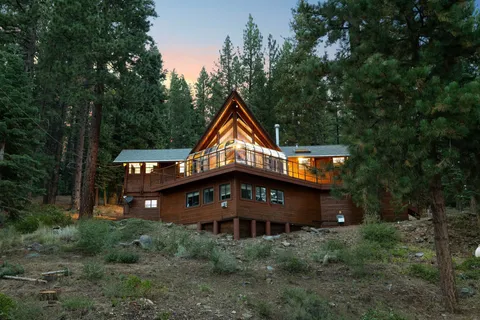 a view of a city with lush green forest