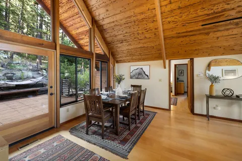 a view of a patio with table and chairs