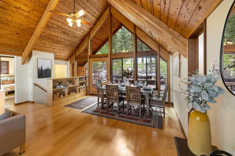 a living room with lots of furniture and a large window