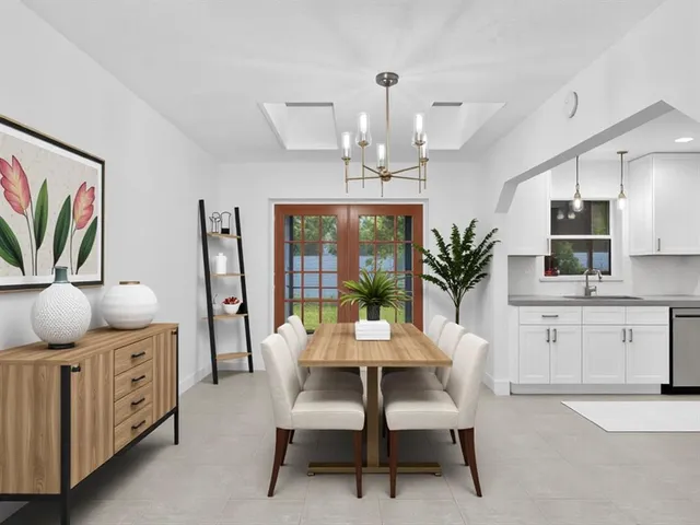 a kitchen with stainless steel appliances a refrigerator sink and cabinets