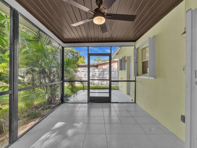 a view of a backyard with a tree
