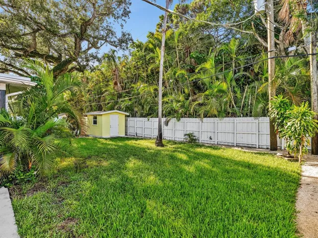 a view of a back yard of the house