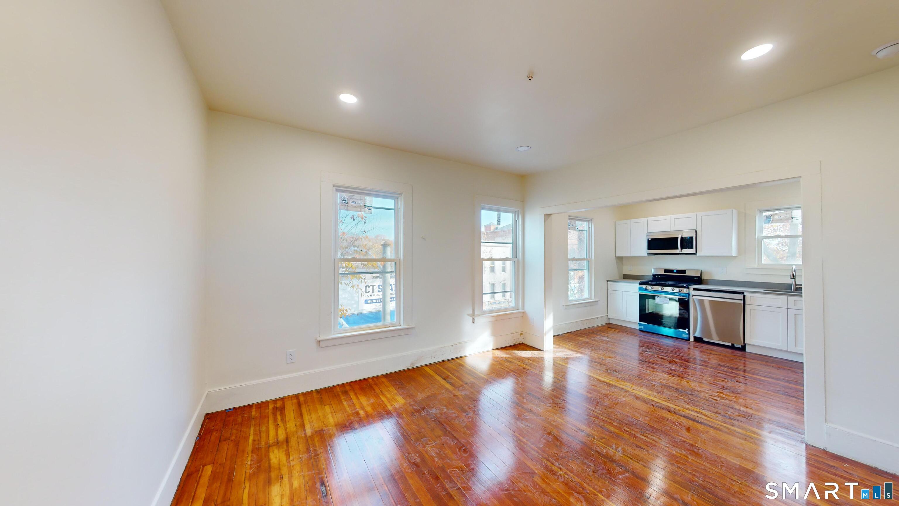 736 Main Street Windham, CT 06226 - Photo 11 of 12 a view of a kitchen with microwave and windows