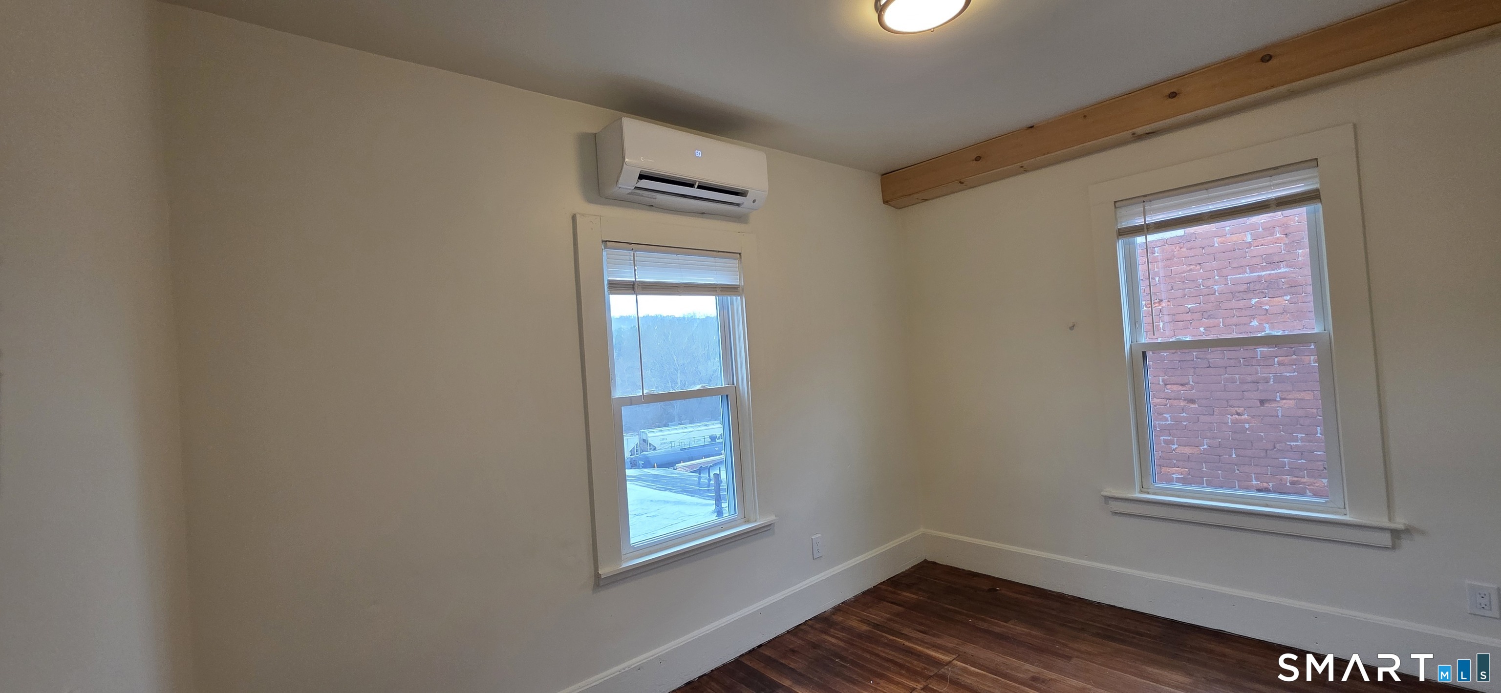 736 Main Street Windham, CT 06226 - Photo 14 of 16 an empty room with windows