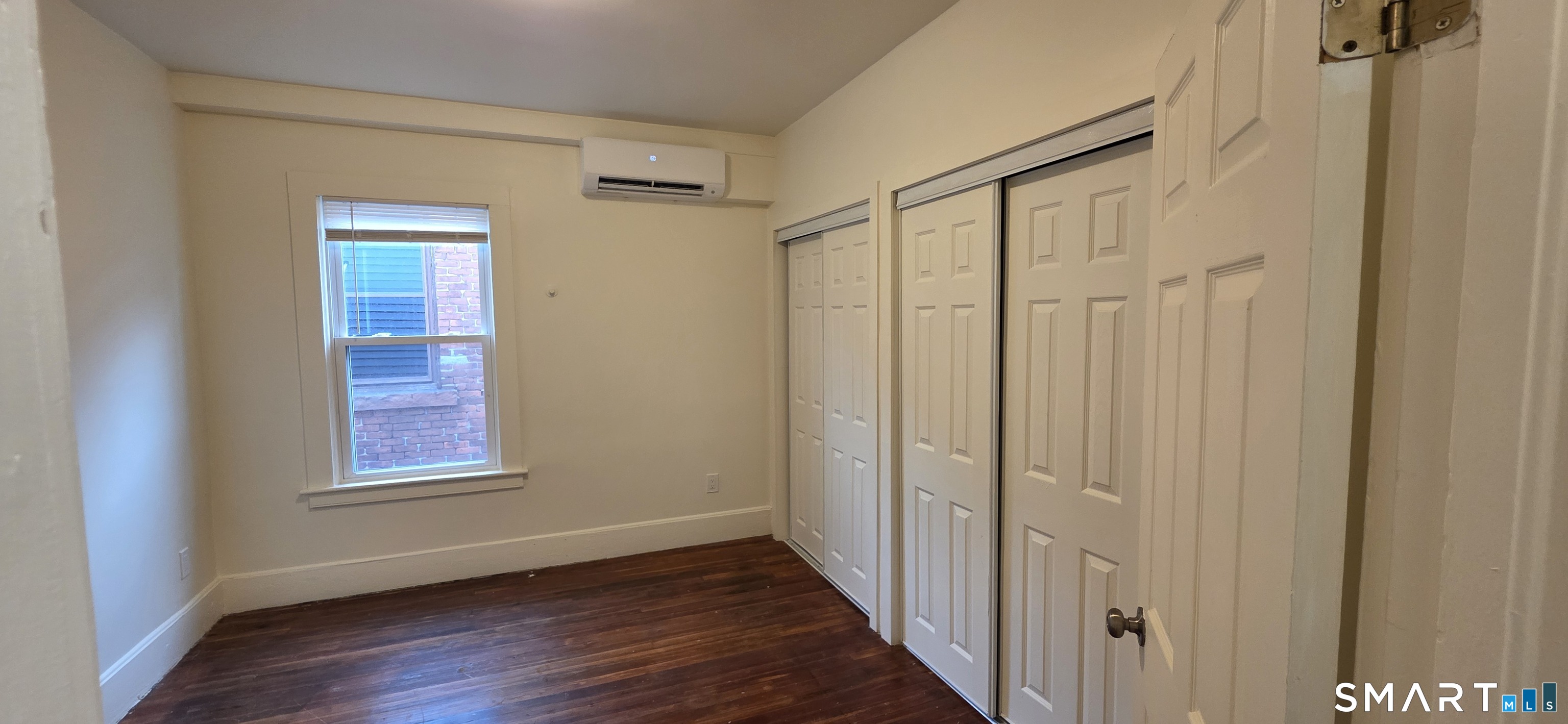 736 Main Street Windham, CT 06226 - Photo 16 of 16 a view of an empty room with wooden floor and a window