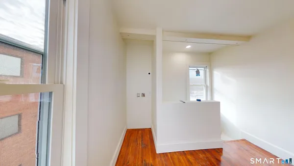 a view of a livingroom with wooden floor