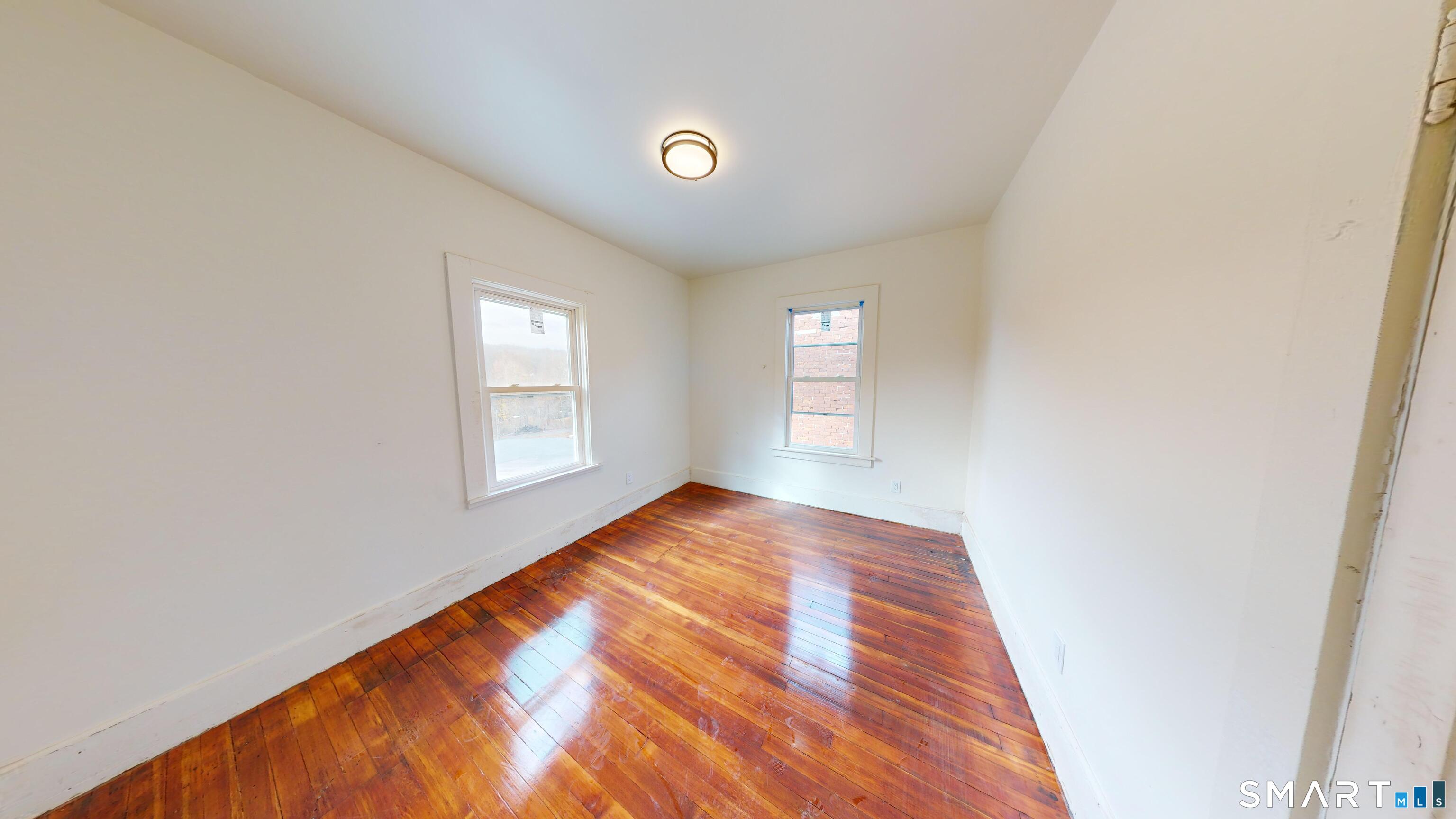 736 Main Street Windham, CT 06226 - Photo 5 of 12 a view of an empty room and window
