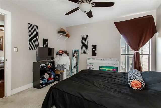 a kitchen with kitchen island a refrigerator a table and chairs in it