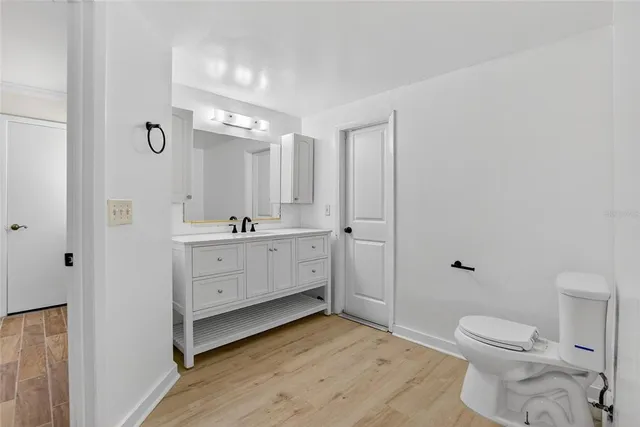 a view of a small space with window and hardwood floor