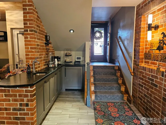 a kitchen with sink and cabinets