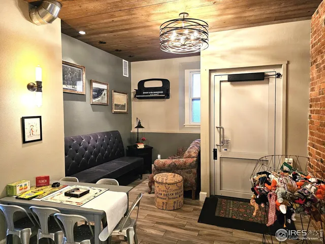 a bedroom with furniture and a chandelier