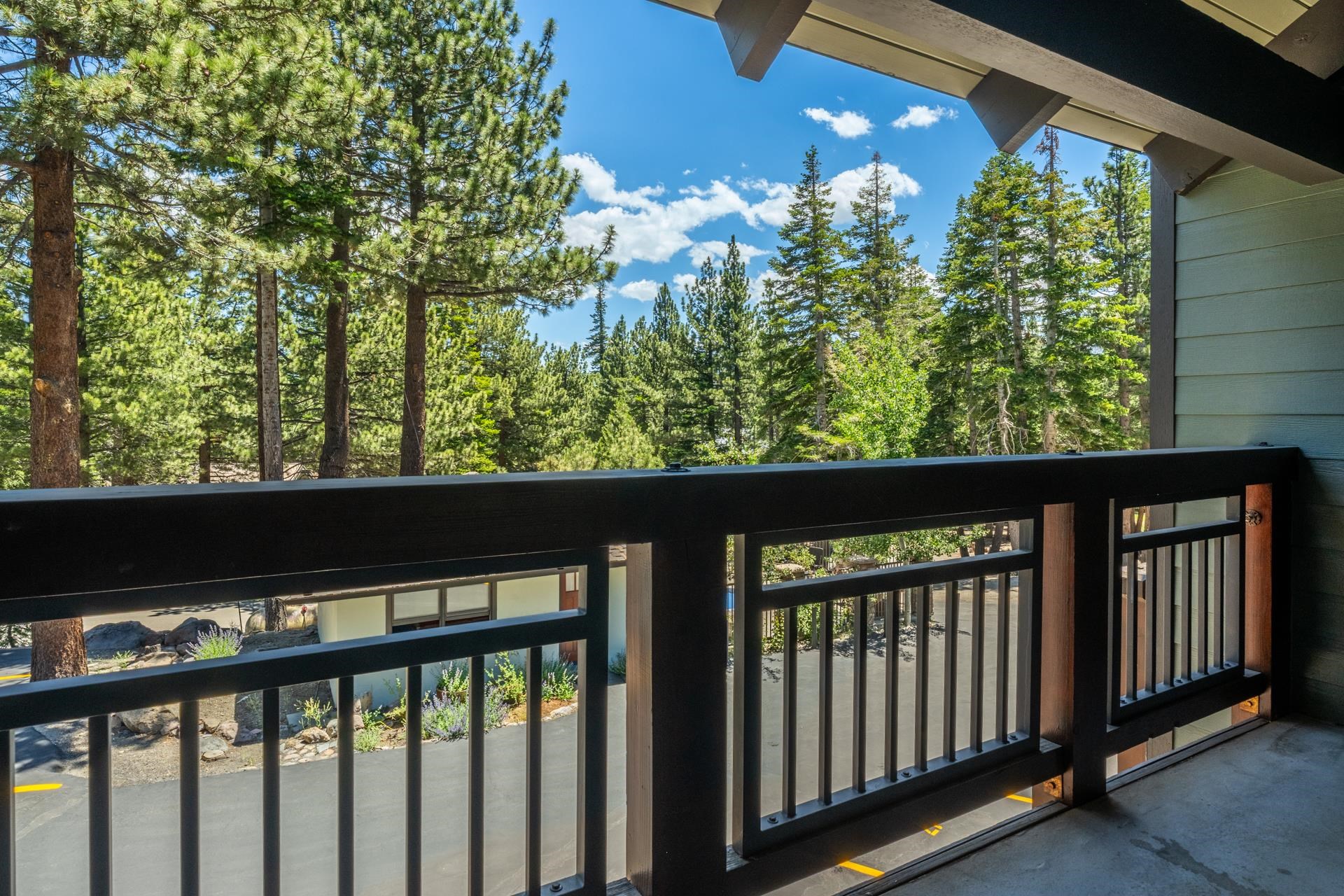 50 Hidden Valley Road, Unit 17 Mammoth Lakes, CA 93546 - Photo 22 of 40 Private balcony featuring dark wood railings and a concrete floor