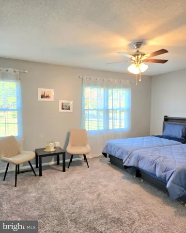 a bedroom with a bed furniture and a window