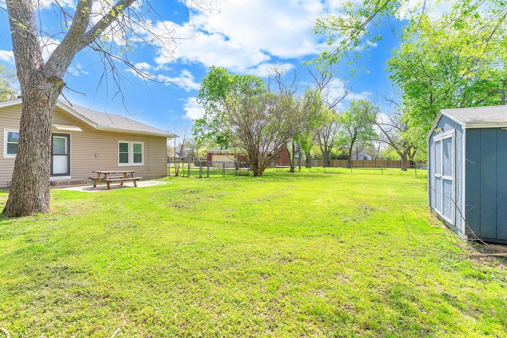 914 Prairie Avenue Cleburne, TX 76033 - Photo 17 of 19 a view of a house with a big yard and potted plants