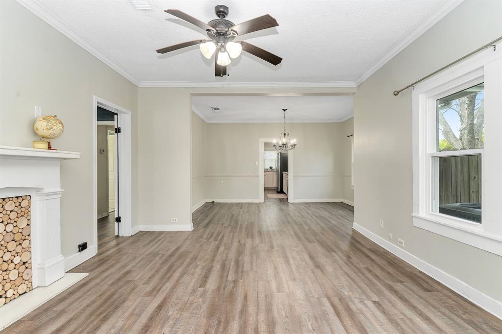914 Prairie Avenue Cleburne, TX 76033 - Photo 5 of 19 wooden floor in an empty room with a window