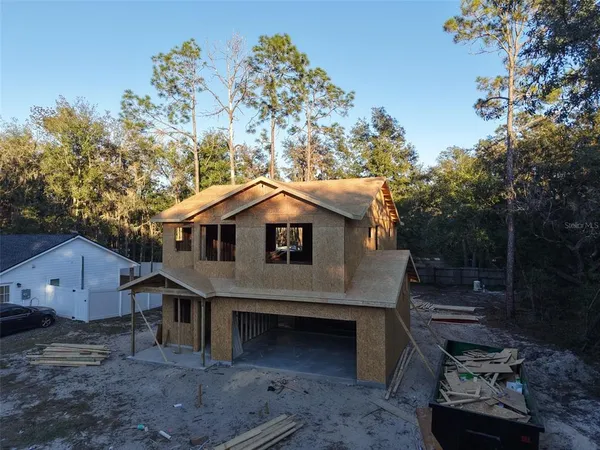 a top view of a house with a yard