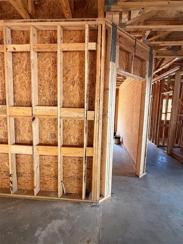 a view of a room with wooden floor and windows