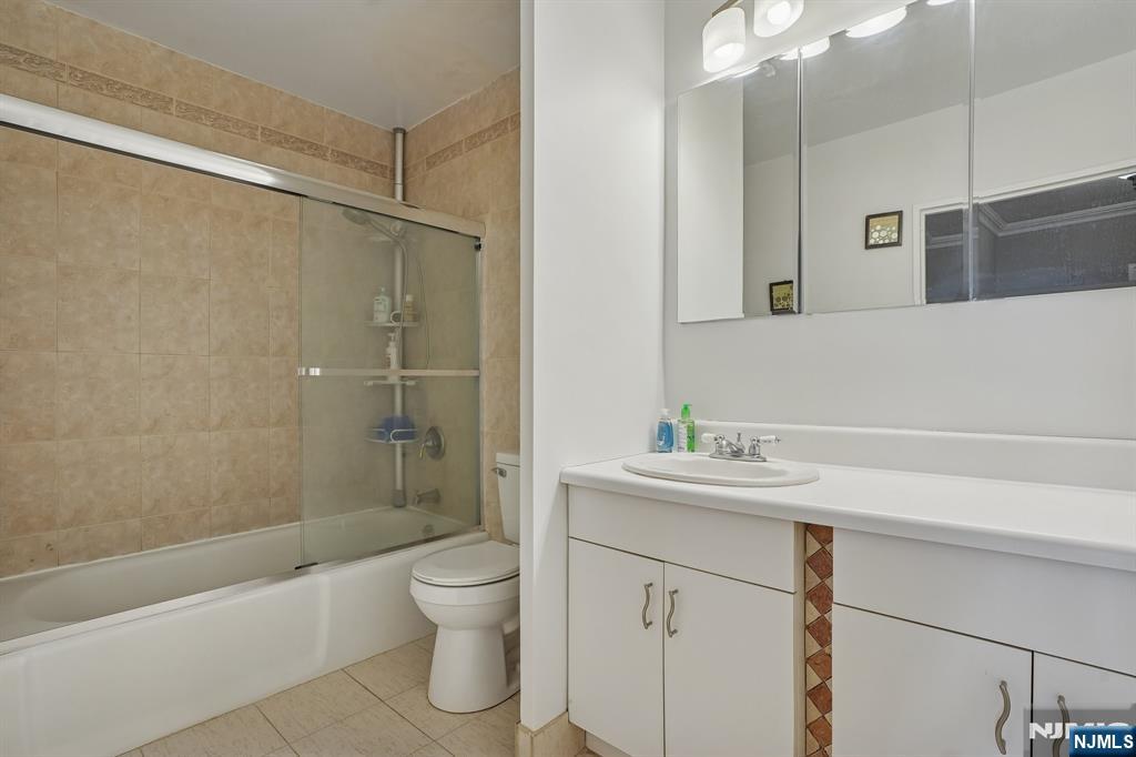5 Horizon Road, Unit 2304 Fort Lee, NJ 07024 - Photo 22 of 33 a bathroom with a sink a toilet and shower